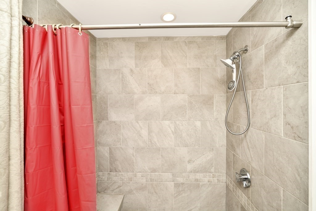106 Haynes Road Stoughton, MA 02072 - Photo 13 of 34 a bathroom with a shower curtain and a shower curtain