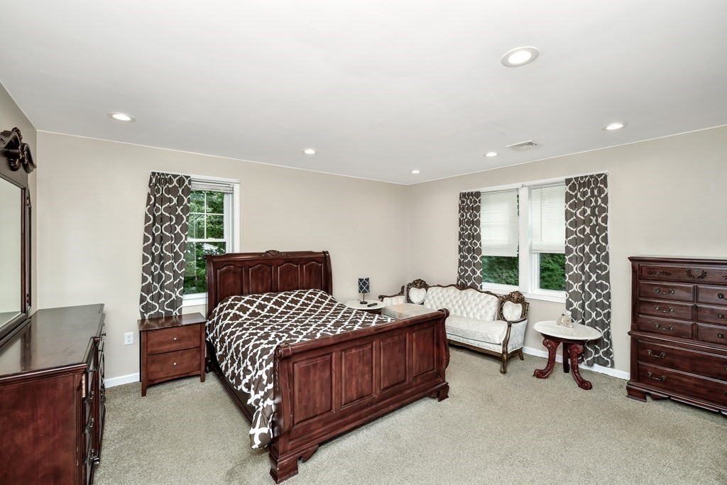 106 Haynes Road Stoughton, MA 02072 - Photo 19 of 34 a bedroom with a bed and a couch