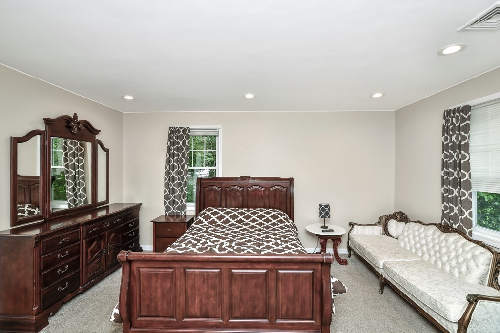 106 Haynes Road Stoughton, MA 02072 - Photo 20 of 34 a bedroom with a bed and window