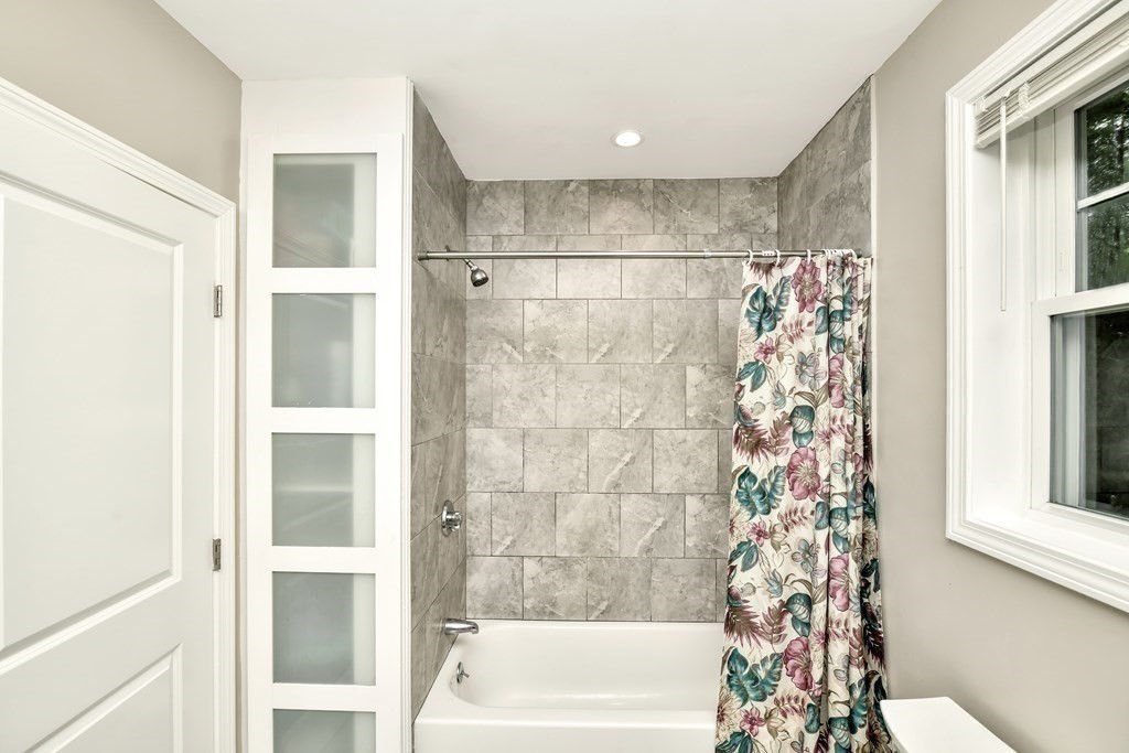 106 Haynes Road Stoughton, MA 02072 - Photo 23 of 34 a bathroom with a bathtub and shower