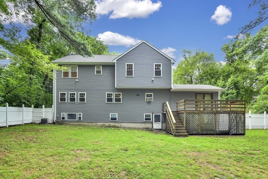 106 Haynes Road Stoughton, MA 02072 - Photo 28 of 34 a front view of a house with a yard