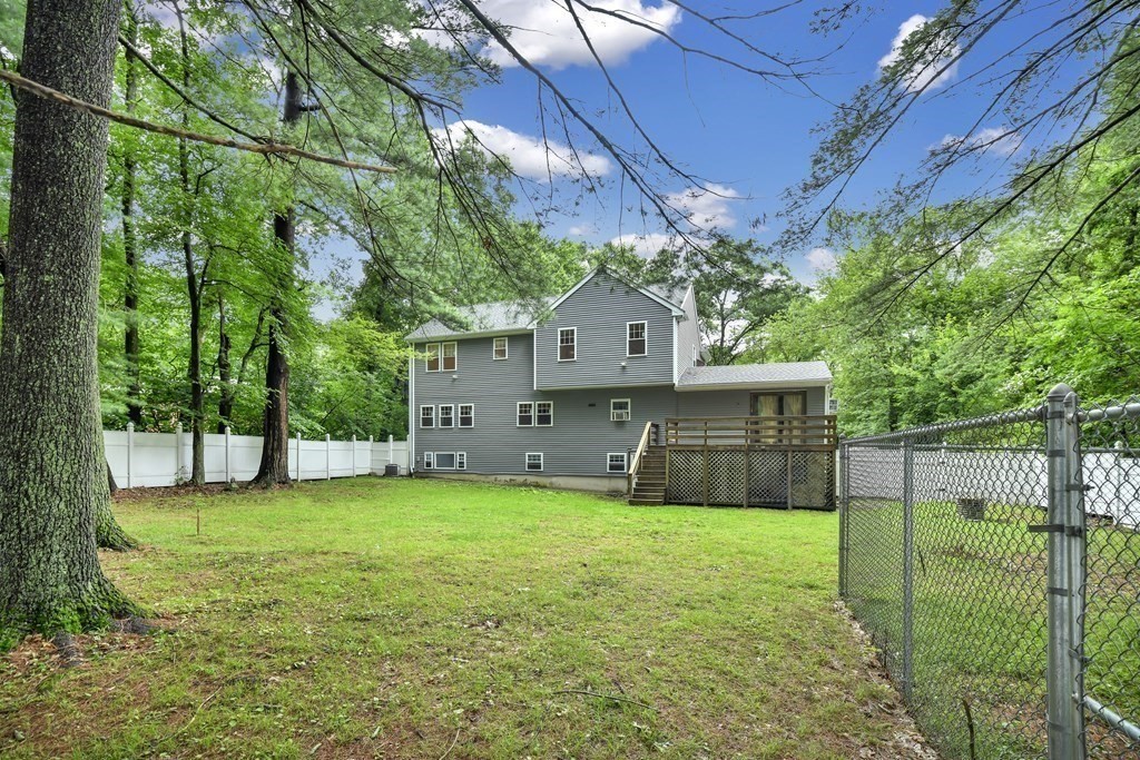 106 Haynes Road Stoughton, MA 02072 - Photo 29 of 34 a view of a house with a yard and sitting area