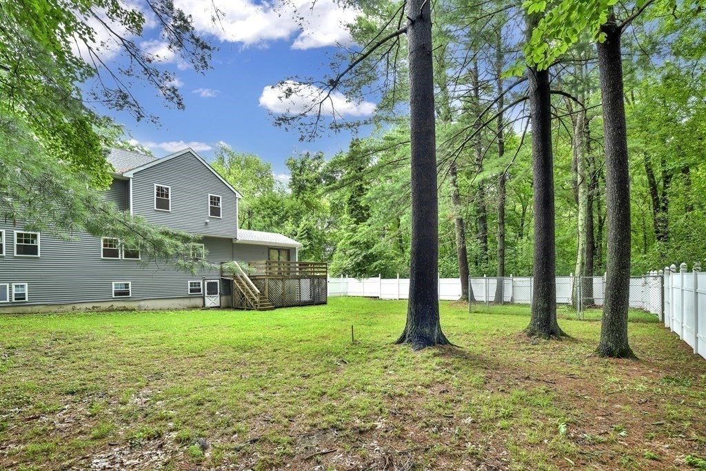 106 Haynes Road Stoughton, MA 02072 - Photo 30 of 34 a view of a house with a yard and sitting area