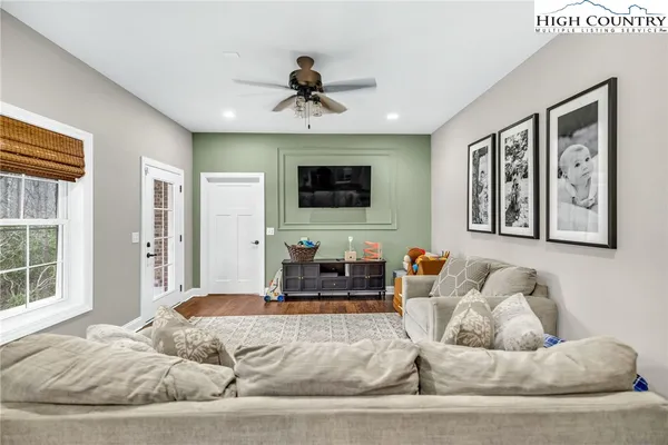 a view of livingroom with furniture and workspace