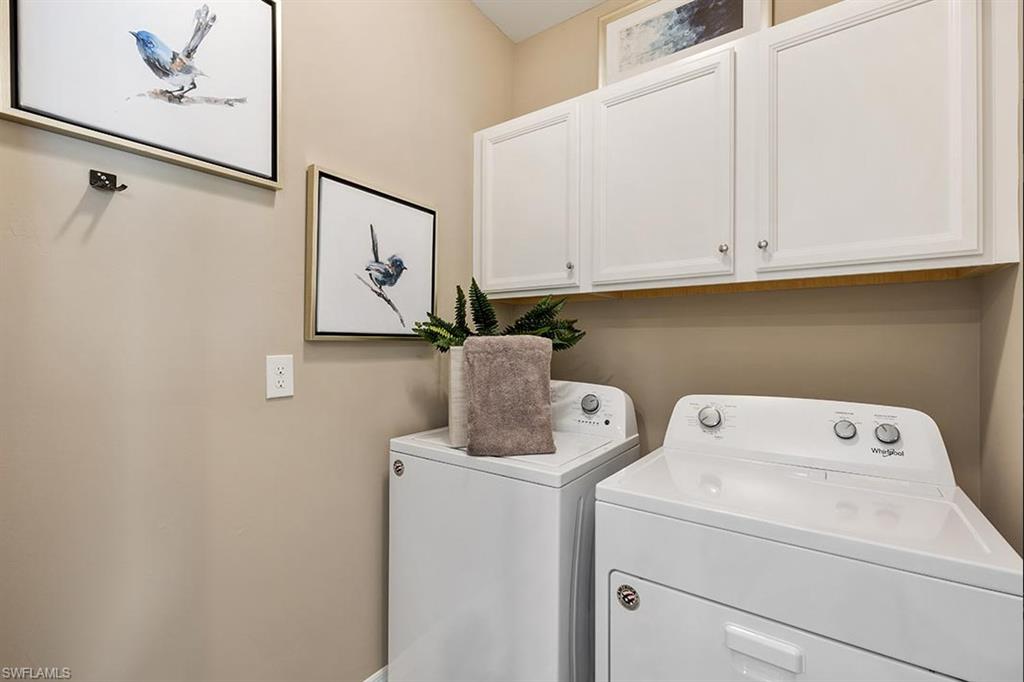 922 Enbrook Loop, Unit 46 Naples, FL 34114 - Photo 14 of 31 a utility room with dryer and washer