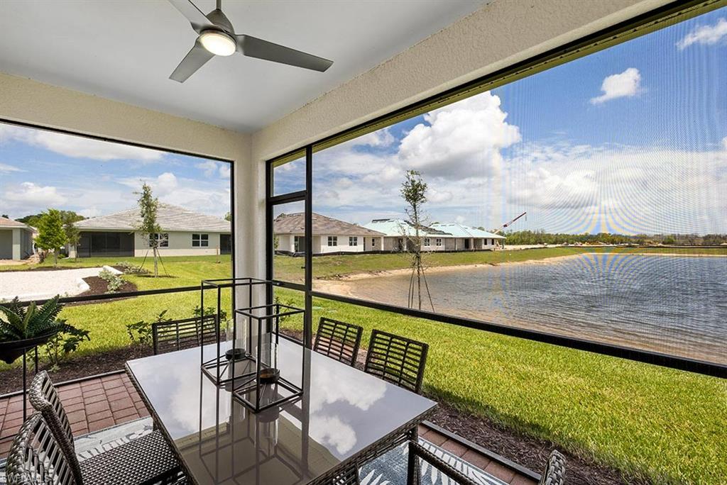 922 Enbrook Loop, Unit 46 Naples, FL 34114 - Photo 15 of 31 a view of swimming pool with a table and chairs