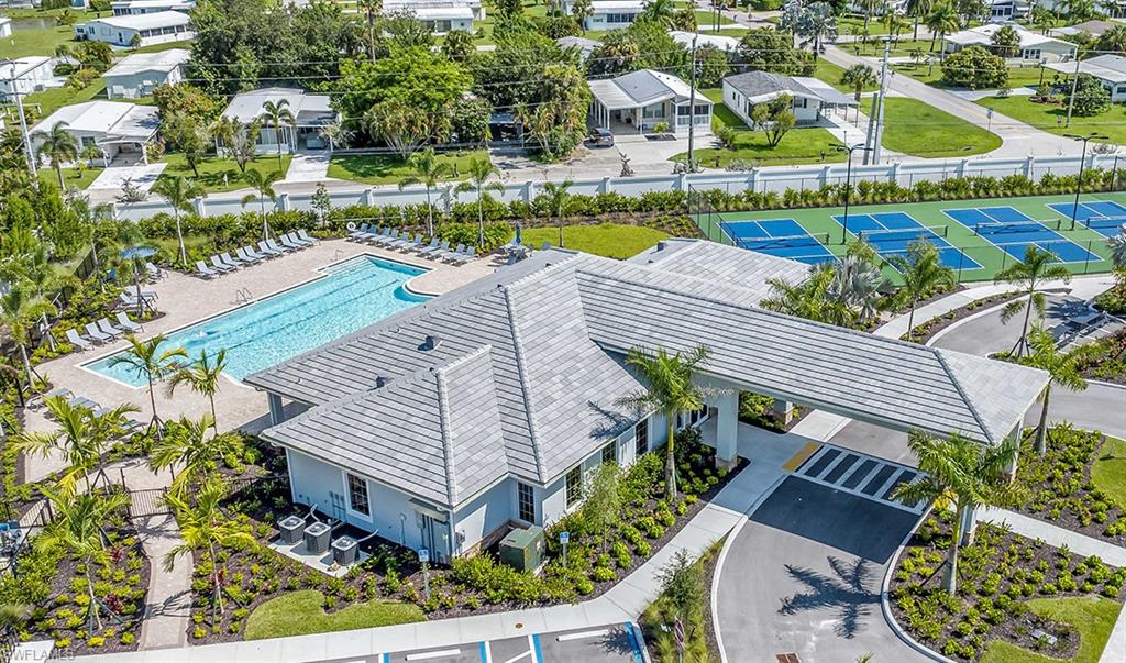 922 Enbrook Loop, Unit 46 Naples, FL 34114 - Photo 18 of 31 a view of a swimming pool with outdoor seating and plants