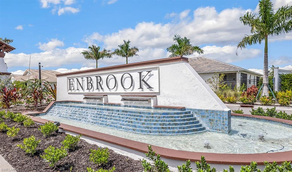 922 Enbrook Loop, Unit 46 Naples, FL 34114 - Photo 22 of 31 a sign on the side of a building