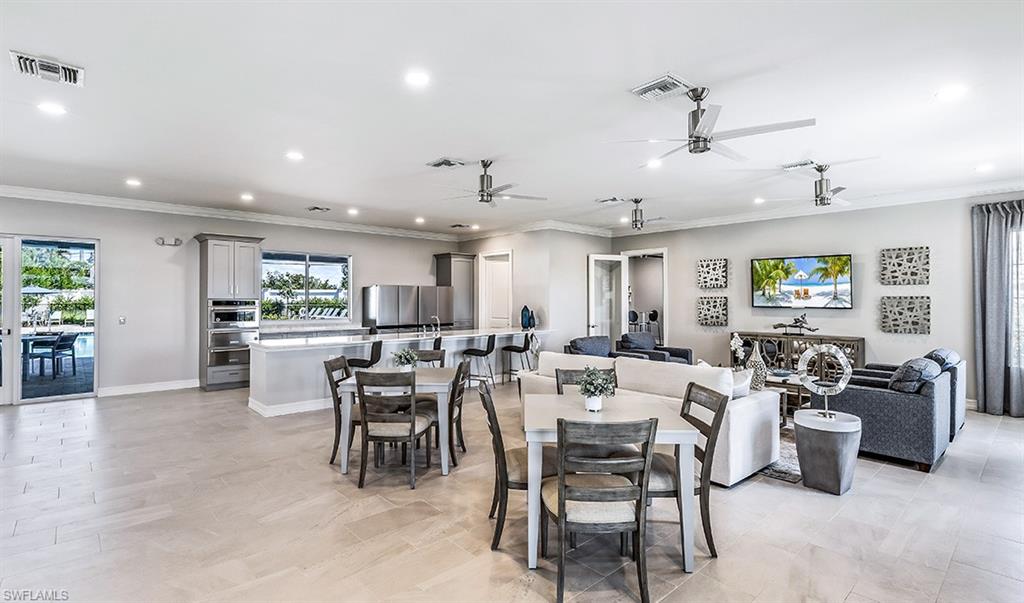 922 Enbrook Loop, Unit 46 Naples, FL 34114 - Photo 26 of 31 a view of a dining area with furniture