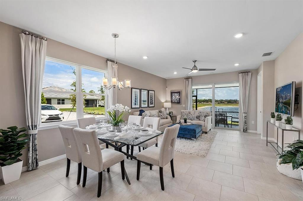 922 Enbrook Loop, Unit 46 Naples, FL 34114 - Photo 5 of 31 a view of a dining room with furniture window and outside view