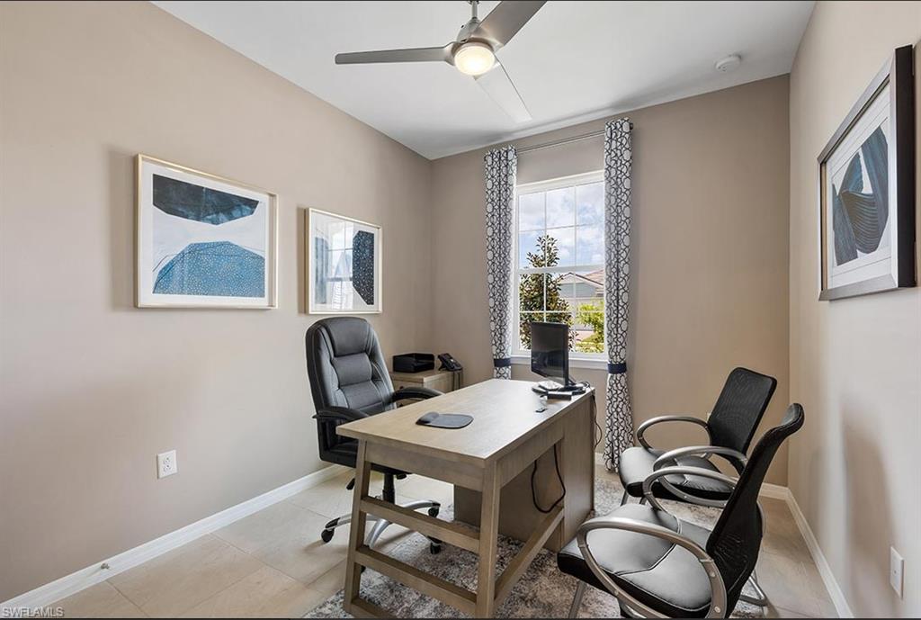 922 Enbrook Loop, Unit 46 Naples, FL 34114 - Photo 7 of 31 a view of a workspace with furniture and a window