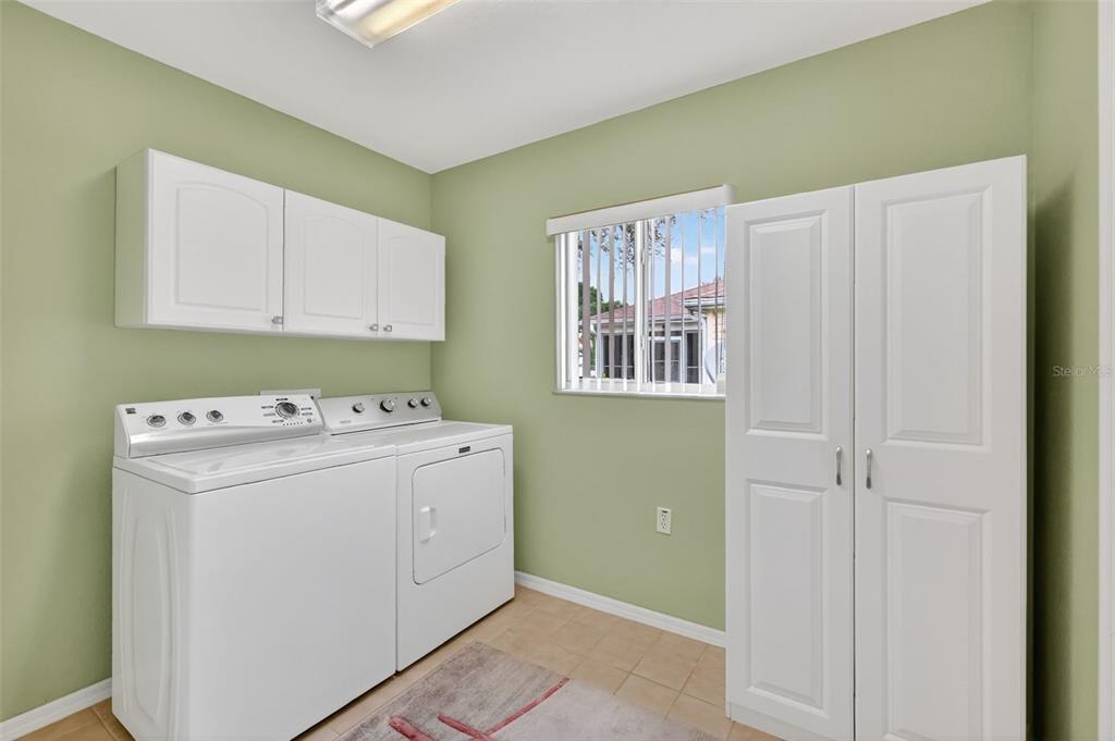 11353 Southwest 138th Lane Dunnellon, FL 34432 - Photo 19 of 33 a utility room with dryer and washer