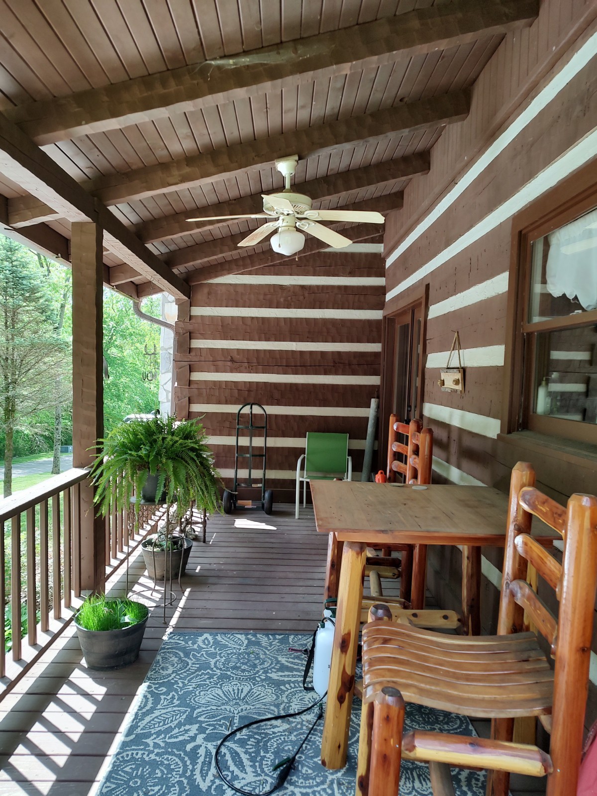 4934 Bethesda-Duplex Road College Grove, TN 37046 - Photo 3 of 18 a view of a patio with a table chairs and a potted plant