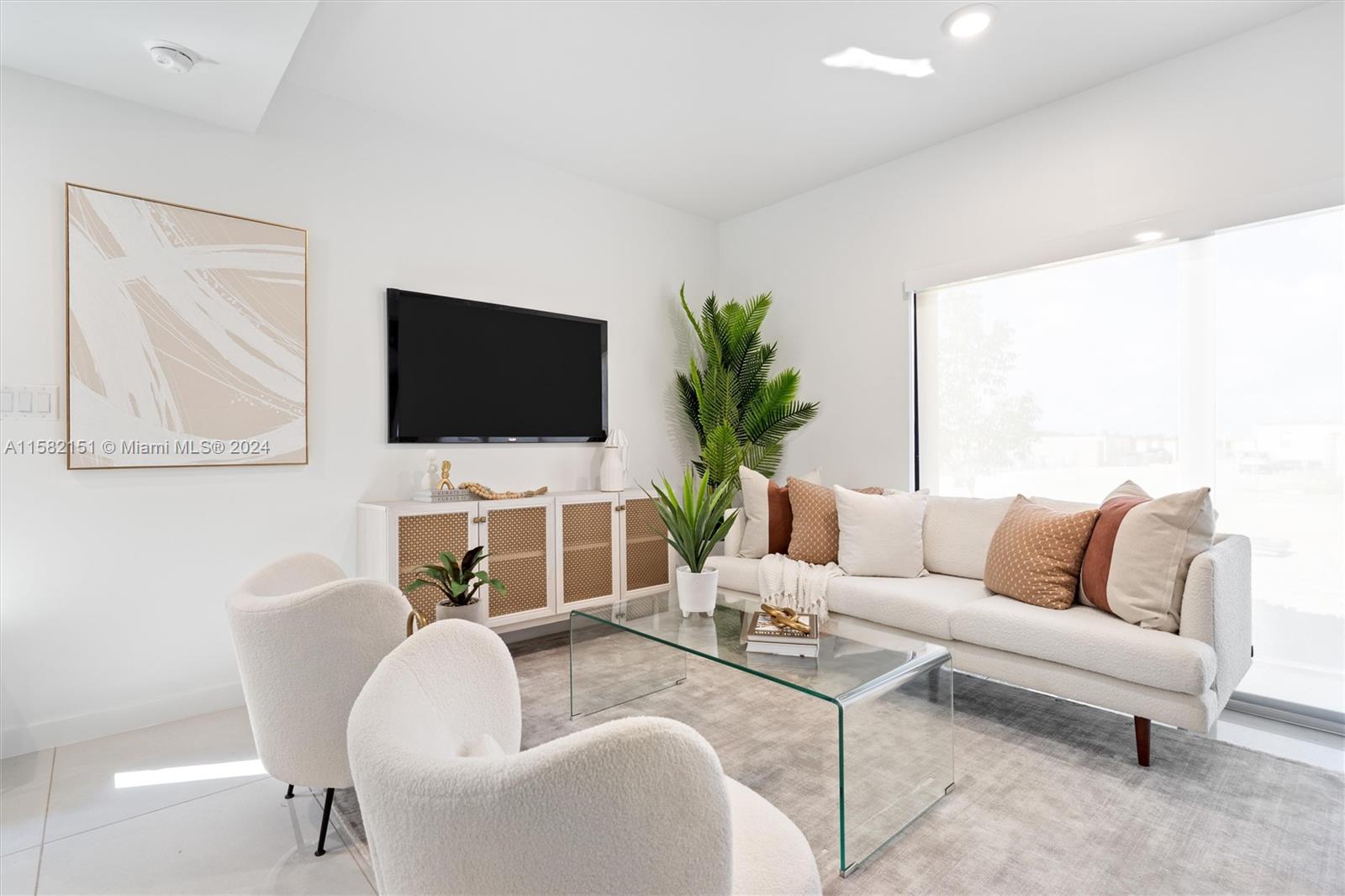 214 Northwest 13th Street Florida City, FL 33034 - Photo 12 of 31 a living room with furniture and a flat screen tv
