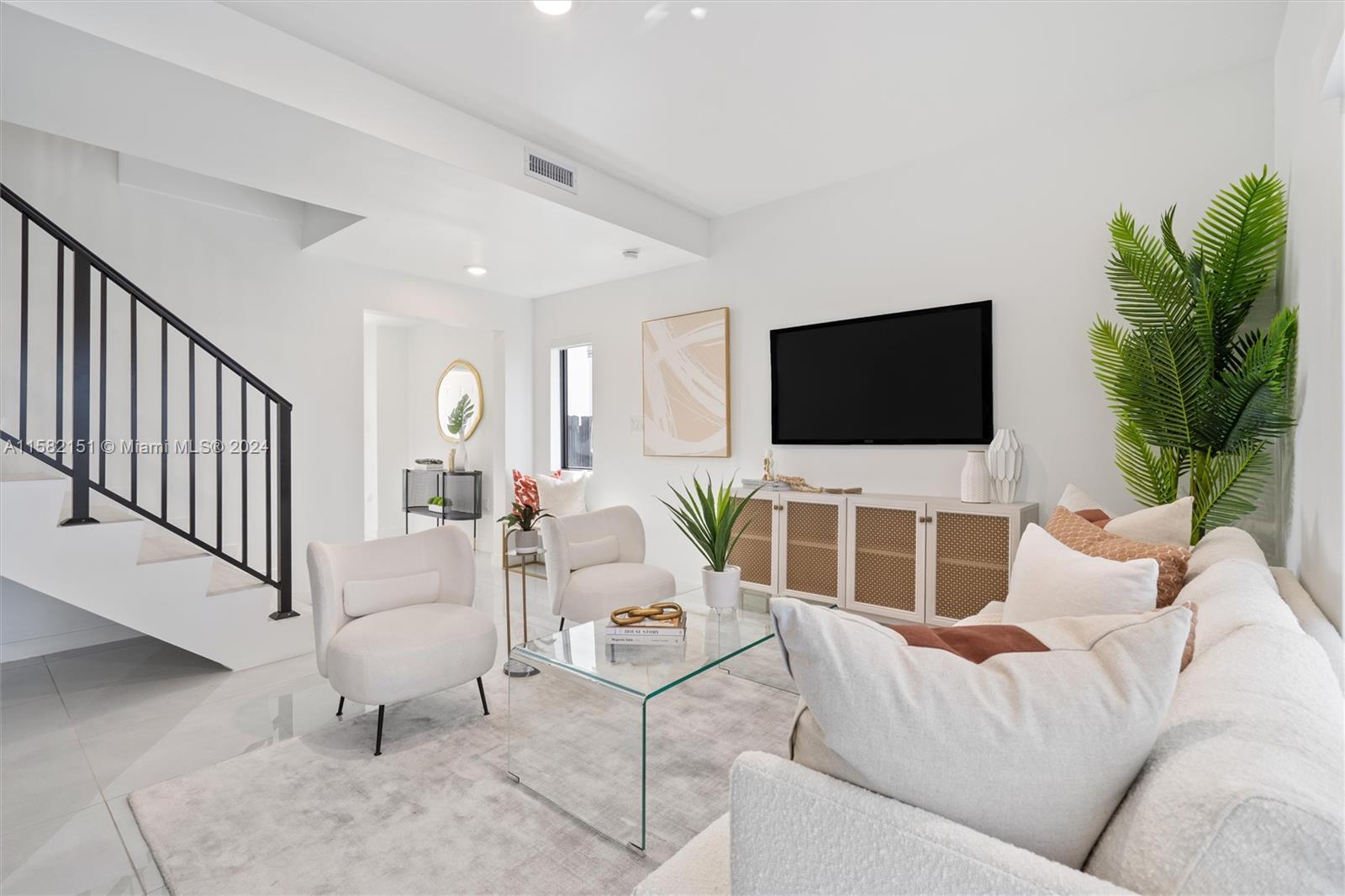 214 Northwest 13th Street Florida City, FL 33034 - Photo 13 of 31 a living room with furniture and a flat screen tv