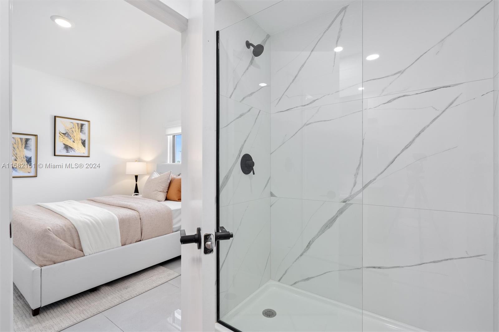 214 Northwest 13th Street Florida City, FL 33034 - Photo 21 of 31 a bathroom with a bathtub and a shower