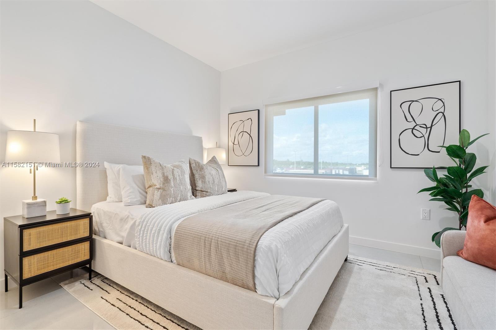 214 Northwest 13th Street Florida City, FL 33034 - Photo 25 of 31 a bedroom with a bed and a window