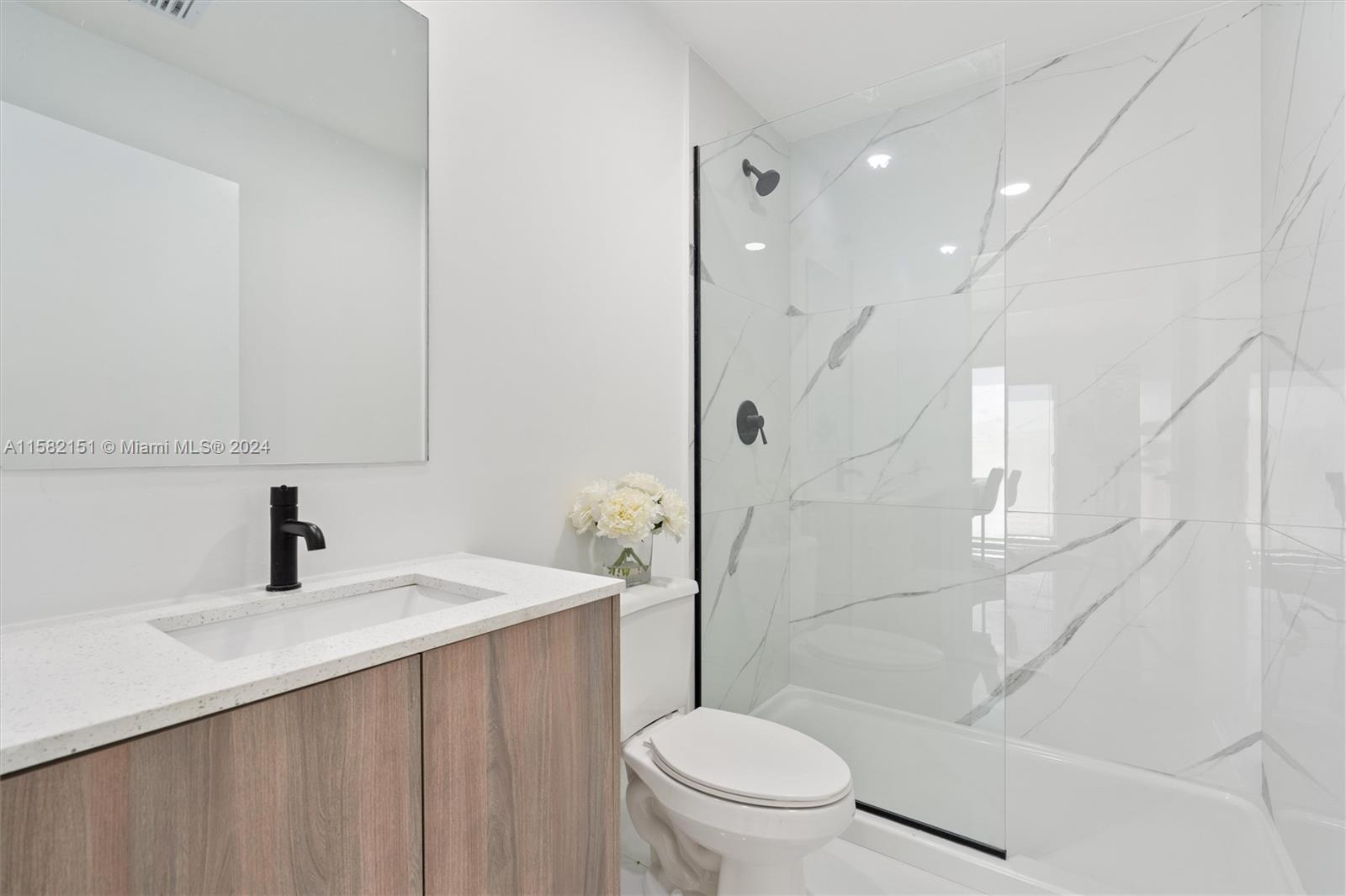 214 Northwest 13th Street Florida City, FL 33034 - Photo 29 of 31 a bathroom with a sink a toilet and shower