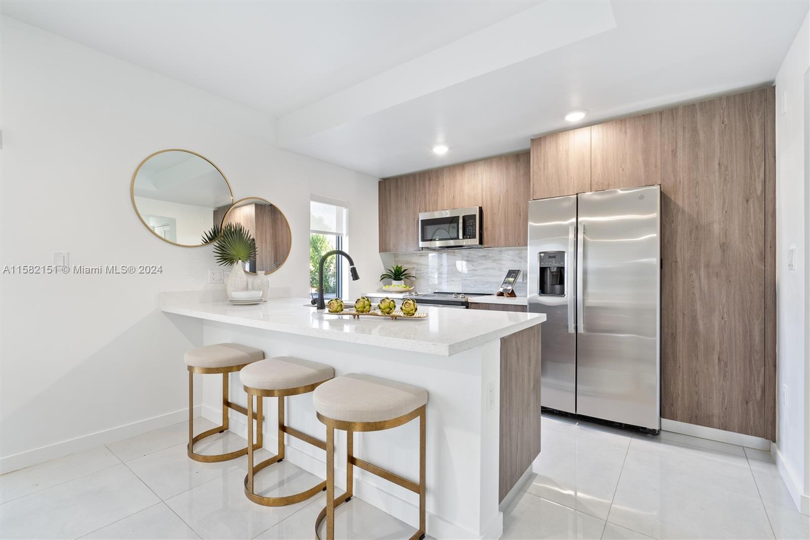 214 Northwest 13th Street Florida City, FL 33034 - Photo 5 of 31 a kitchen with kitchen island a counter space a sink appliances and cabinets