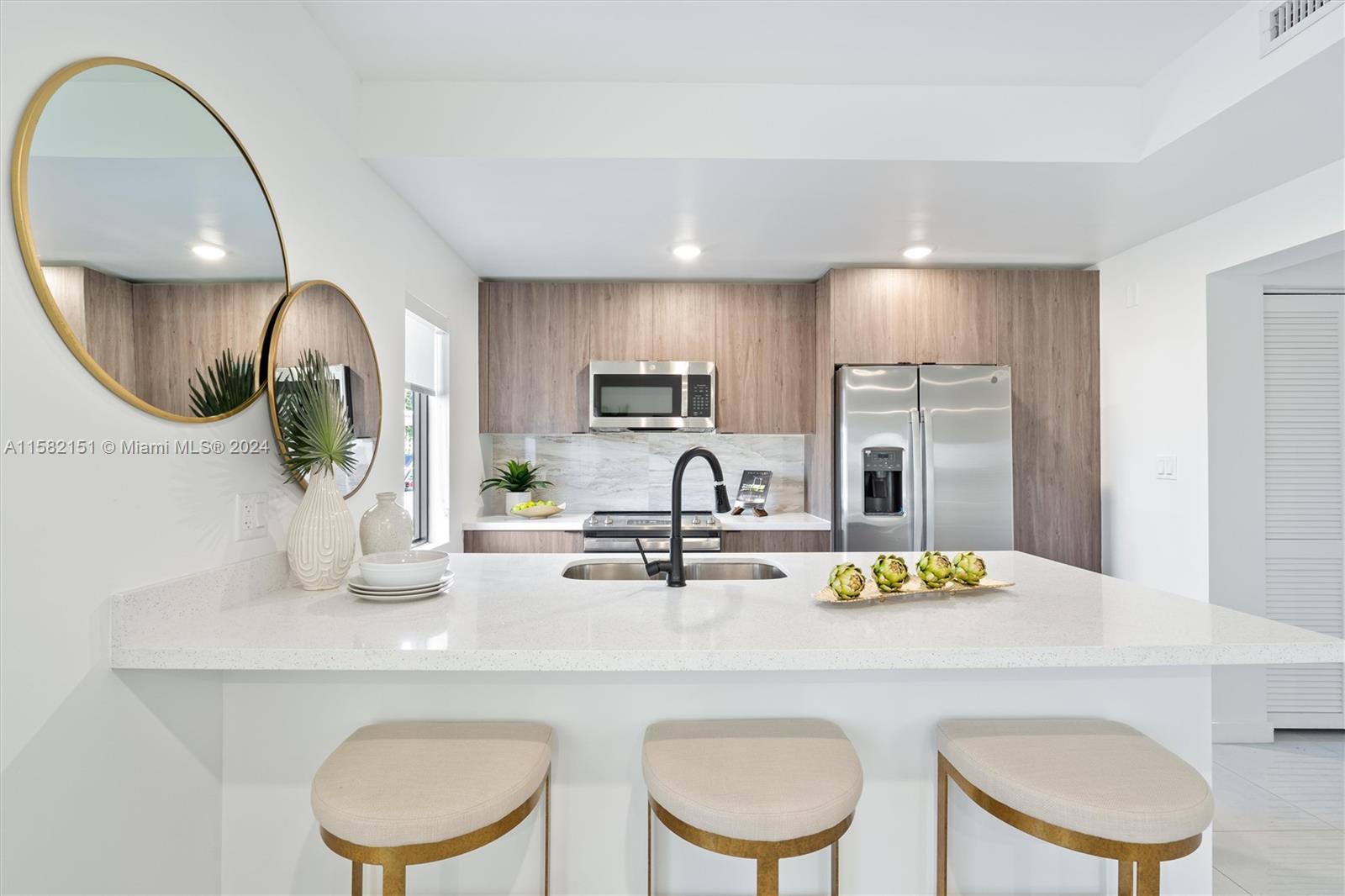 214 Northwest 13th Street Florida City, FL 33034 - Photo 6 of 31 a kitchen with a sink a table and chairs