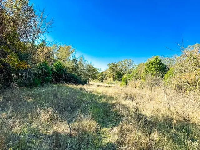 a view of ocean with a big yard