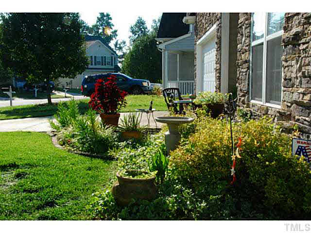 3102 Rendezvous Drive Raleigh, NC 27610 - Photo 3 of 24 a front view of house with a garden