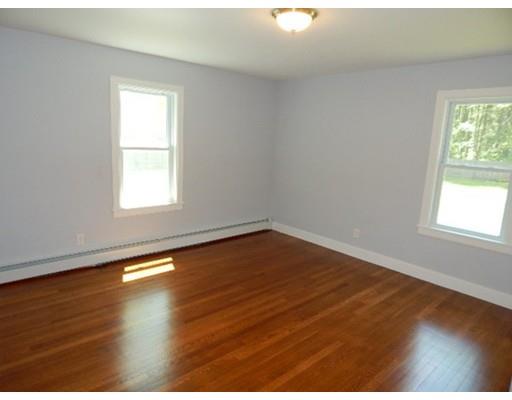 296 Great Road Shirley, MA 01464 - Photo 19 of 22 an empty room with wooden floor and windows