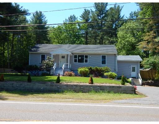 296 Great Road Shirley, MA 01464 - Photo 3 of 22 a front view of a house with a yard and potted plants