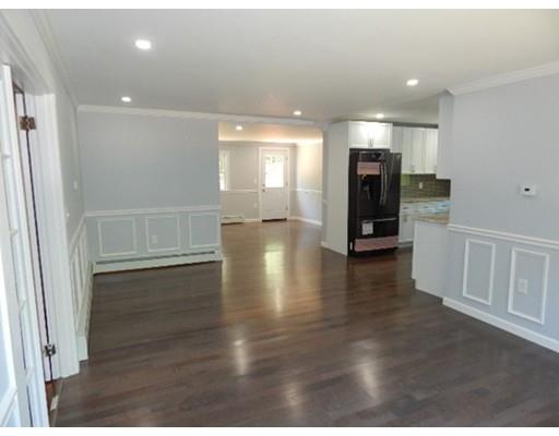 296 Great Road Shirley, MA 01464 - Photo 10 of 22 a view of a hallway with wooden floor and a living room