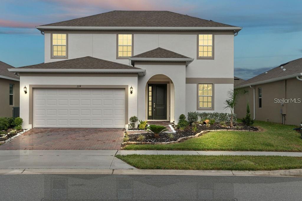 224 Trinity Ridge Circle Davenport, FL 33897 - Photo 1 of 1 a front view of a house with a yard