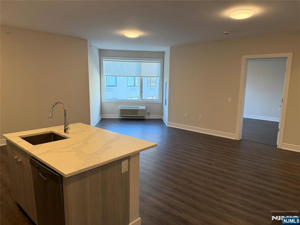 470 Main Street, Unit 703 Fort Lee, NJ 07024 - Photo 4 of 19 a kitchen with a wooden floor and a sink