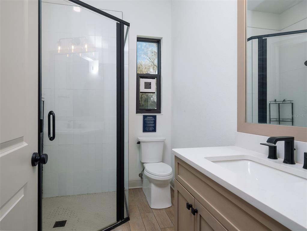 11920 Southeast 22nd Ave Road Ocala, FL 34480 - Photo 17 of 31 a bathroom with a sink a toilet and shower