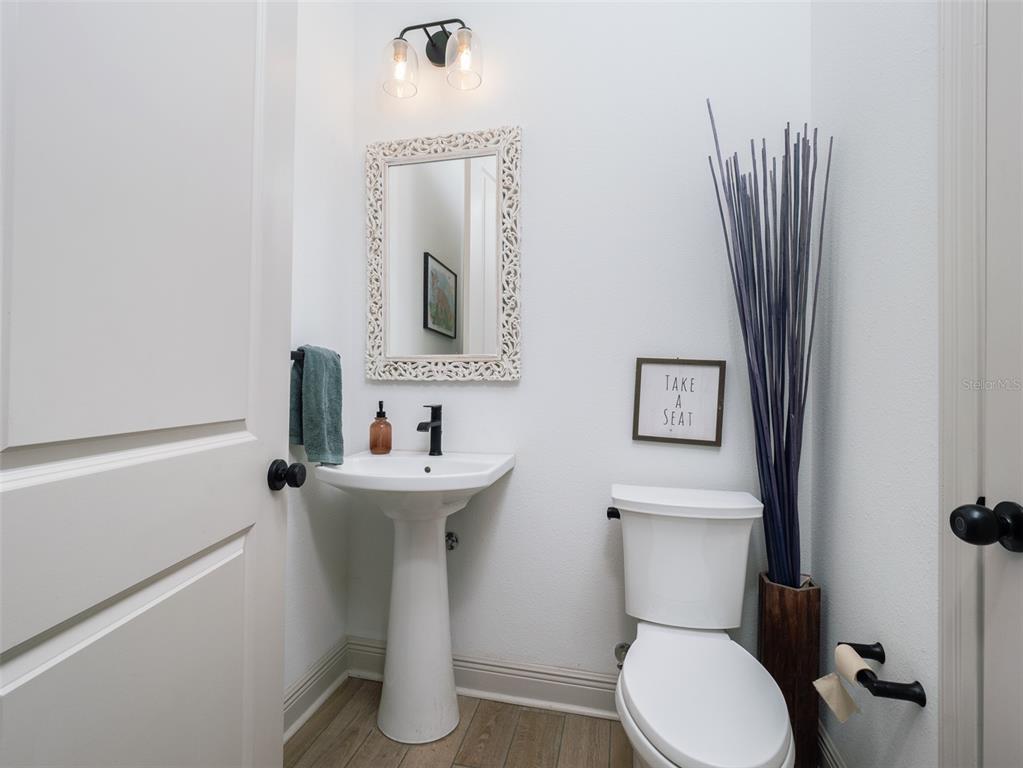 11920 Southeast 22nd Ave Road Ocala, FL 34480 - Photo 20 of 31 a bathroom with a toilet sink and mirror