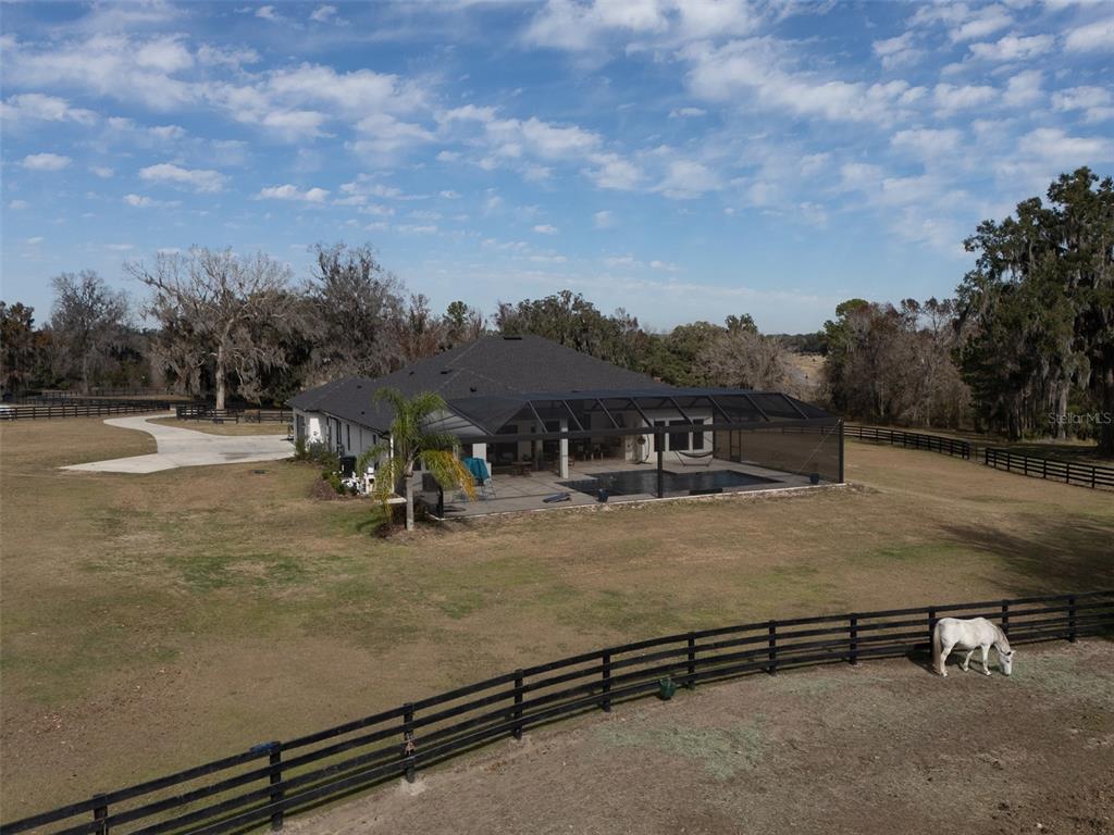 11920 Southeast 22nd Ave Road Ocala, FL 34480 - Photo 25 of 31 an aerial view of residential houses with yard and entertaining space