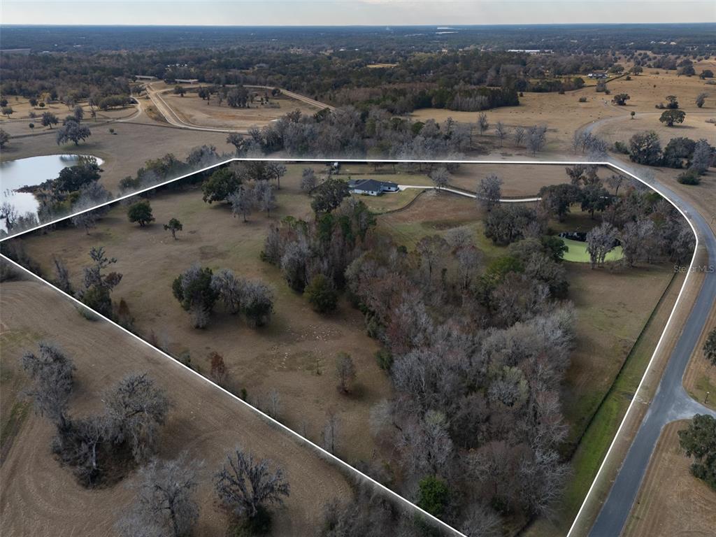 11920 Southeast 22nd Ave Road Ocala, FL 34480 - Photo 30 of 31 an aerial view of residential houses with outdoor space