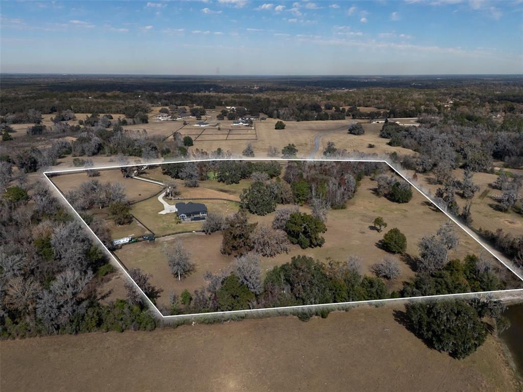 11920 Southeast 22nd Ave Road Ocala, FL 34480 - Photo 31 of 31 an aerial view of a house with a yard