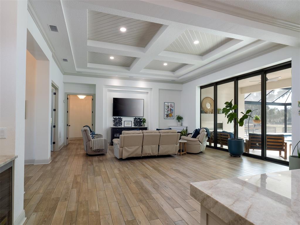 11920 Southeast 22nd Ave Road Ocala, FL 34480 - Photo 6 of 31 a living room with furniture and a flat screen tv