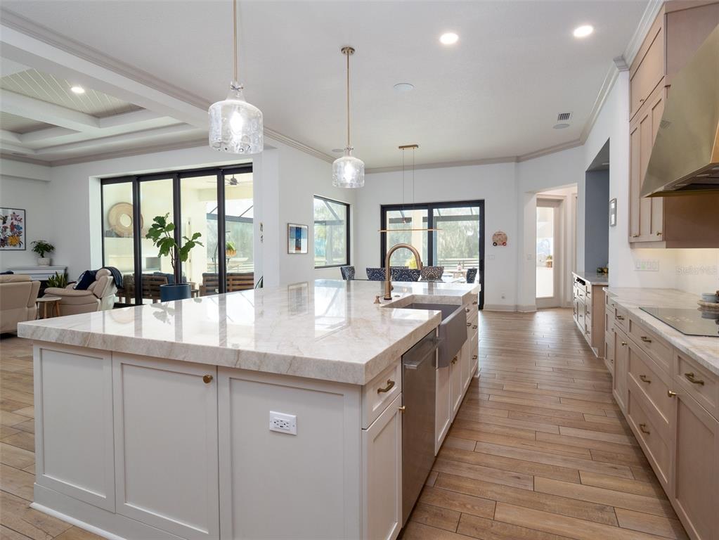 11920 Southeast 22nd Ave Road Ocala, FL 34480 - Photo 10 of 31 a large kitchen with kitchen island a large window a sink and living room view