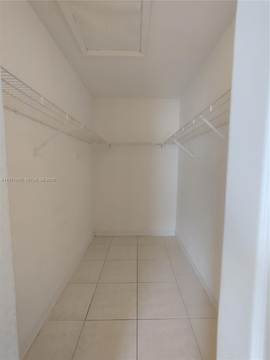 6756 Northwest 182nd Street, Unit 101 Hialeah, FL 33015 - Photo 14 of 29 a view of an empty room