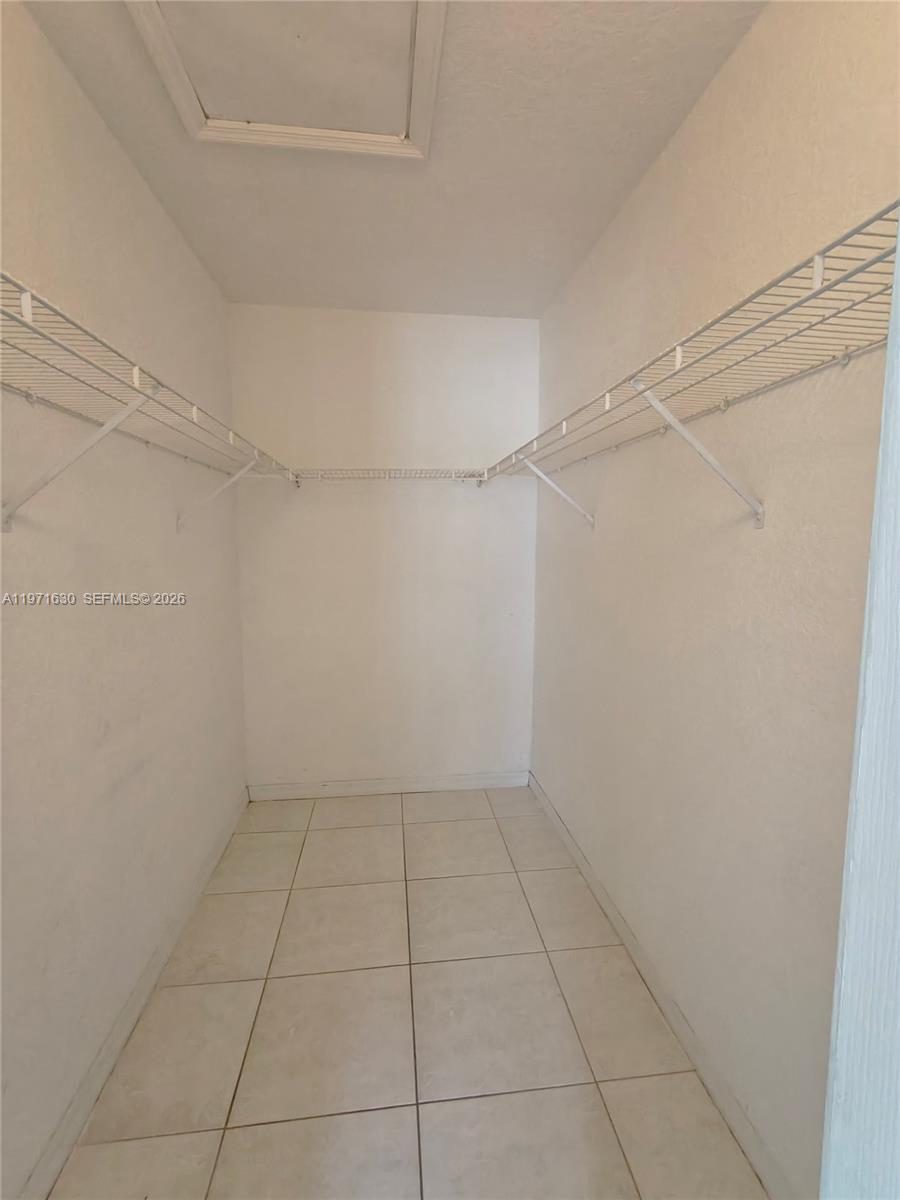 6756 Northwest 182nd Street, Unit 101 Hialeah, FL 33015 - Photo 24 of 29 a view of an empty room