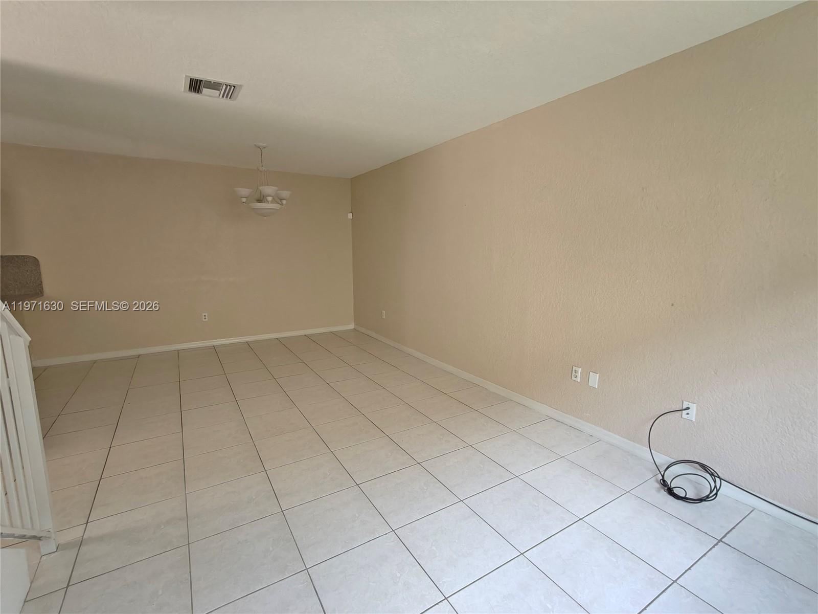 6756 Northwest 182nd Street, Unit 101 Hialeah, FL 33015 - Photo 29 of 29 a view of a room with racks on the wall