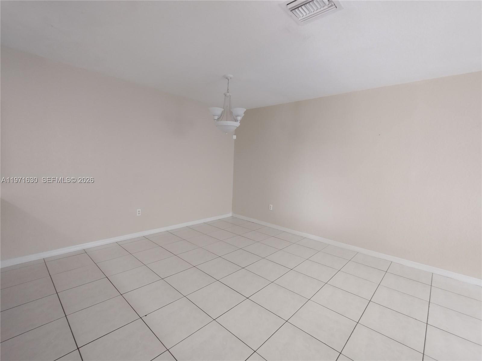 6756 Northwest 182nd Street, Unit 101 Hialeah, FL 33015 - Photo 7 of 29 a view of an empty room