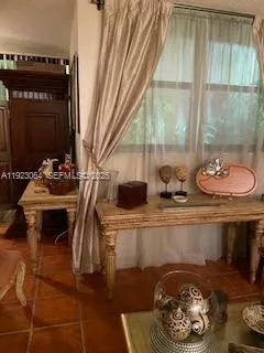 a table with chairs and a stove