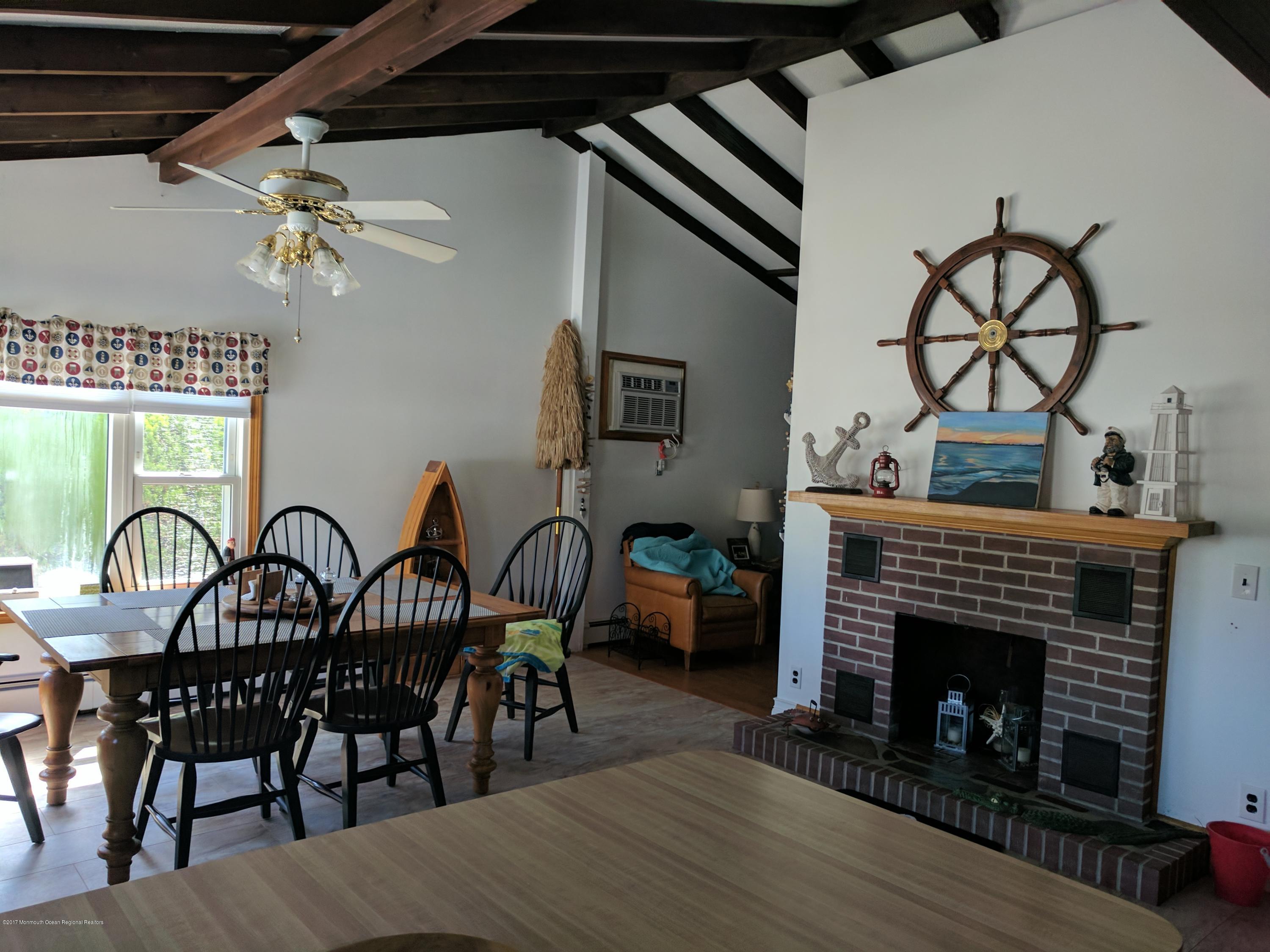 806 Harbor Road Forked River, NJ 08731 - Photo 3 of 12 a dining room with furniture and wooden floor