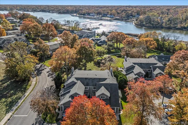 an aerial view of a house with a lake view