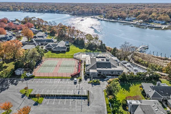 an aerial view of a house with a lake view