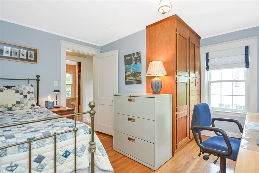 21 Stevens Road Needham, MA 02492 - Photo 17 of 26 a bedroom with a bed and wooden floor