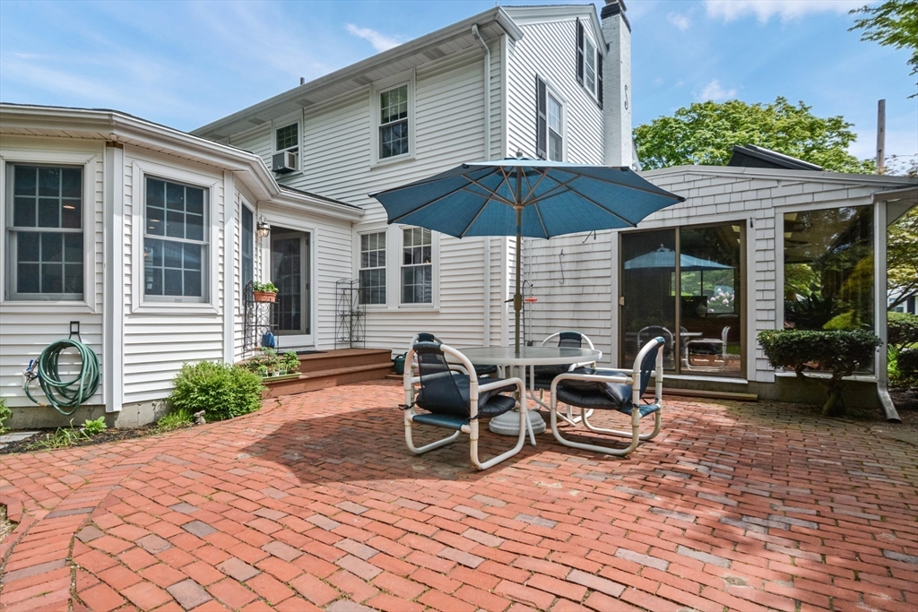 21 Stevens Road Needham, MA 02492 - Photo 22 of 26 a view of a house with backyard and sitting area