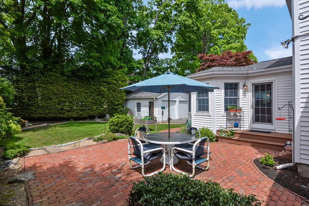 21 Stevens Road Needham, MA 02492 - Photo 23 of 26 a view of a house with backyard and sitting area