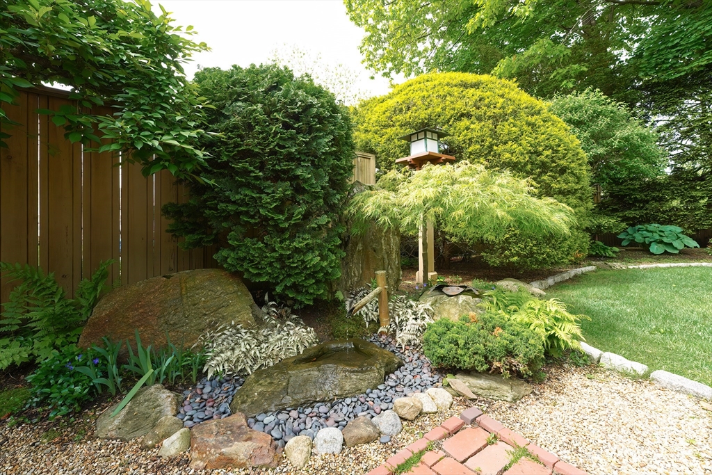 21 Stevens Road Needham, MA 02492 - Photo 24 of 26 a backyard of a house with lots of green space